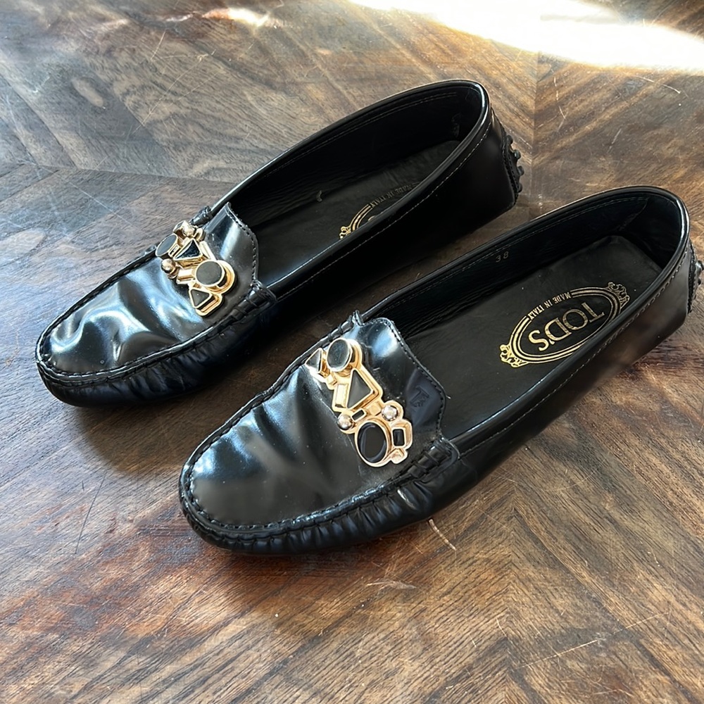 Tod's Black Leather Loafers with Gold Accents